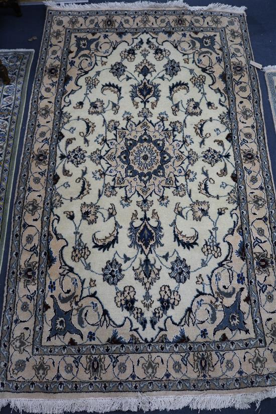 A Nain cream rug 208 x 115cm
